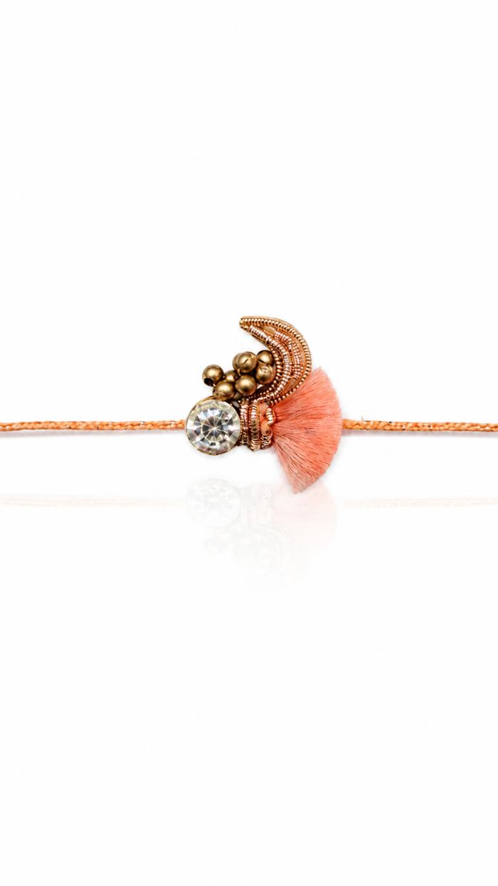 Designer Pure Silver Rakhi with Crystal & Peach Tassel