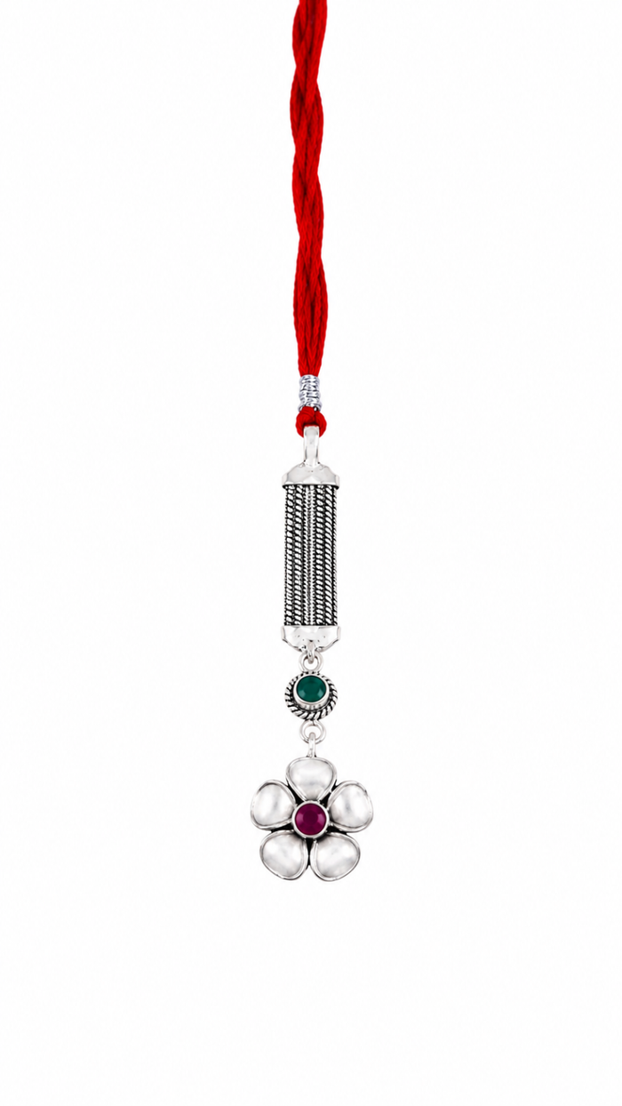 Exquisite Silver Filigree Floral Lumba Rakhi with Ruby Center