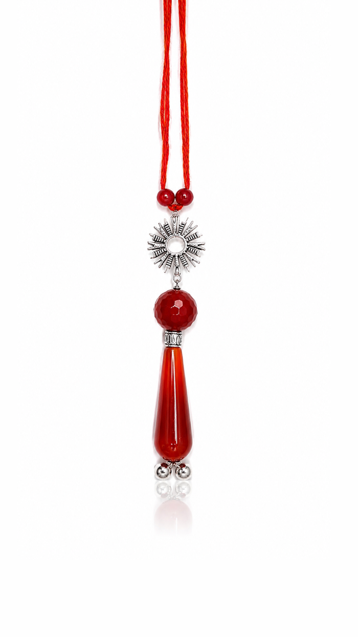 Radiant Sunburst Pure Silver Lumba Rakhi with Red Gemstones